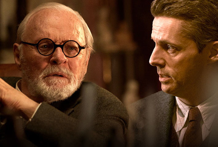 Anthony Hopkins and Matthew Goode in suits edited together.