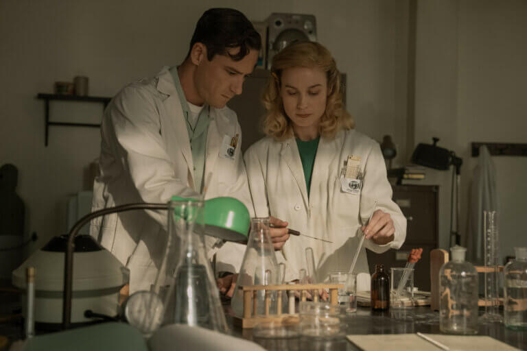Lewis Pullman and Brie Larson in a chemistry lab producing experiments.