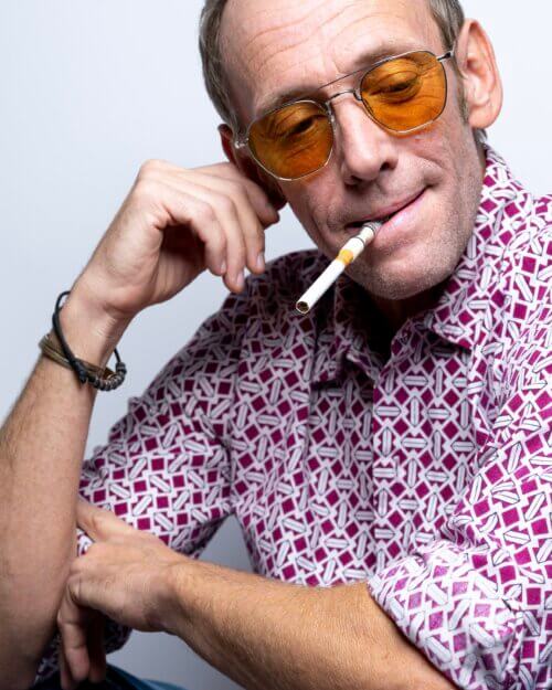 PJ Sosko dressed as Hunter S. Thompson smoking a cigarette.