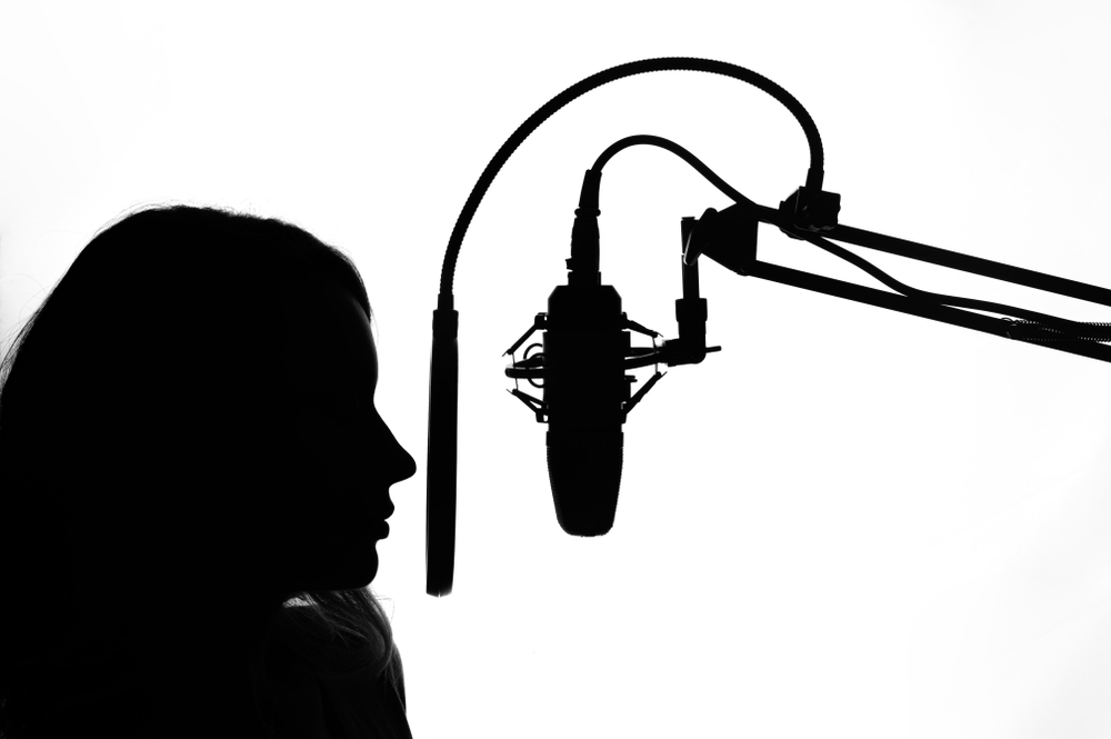 black and white photo of a voice actresses silhouette.